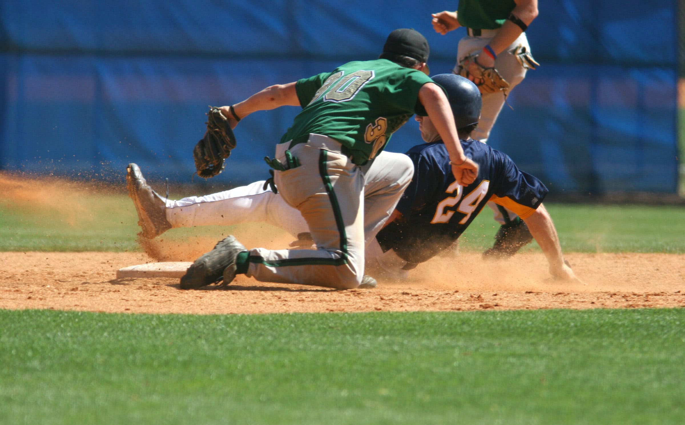 Two baseball players playing a game of baseball