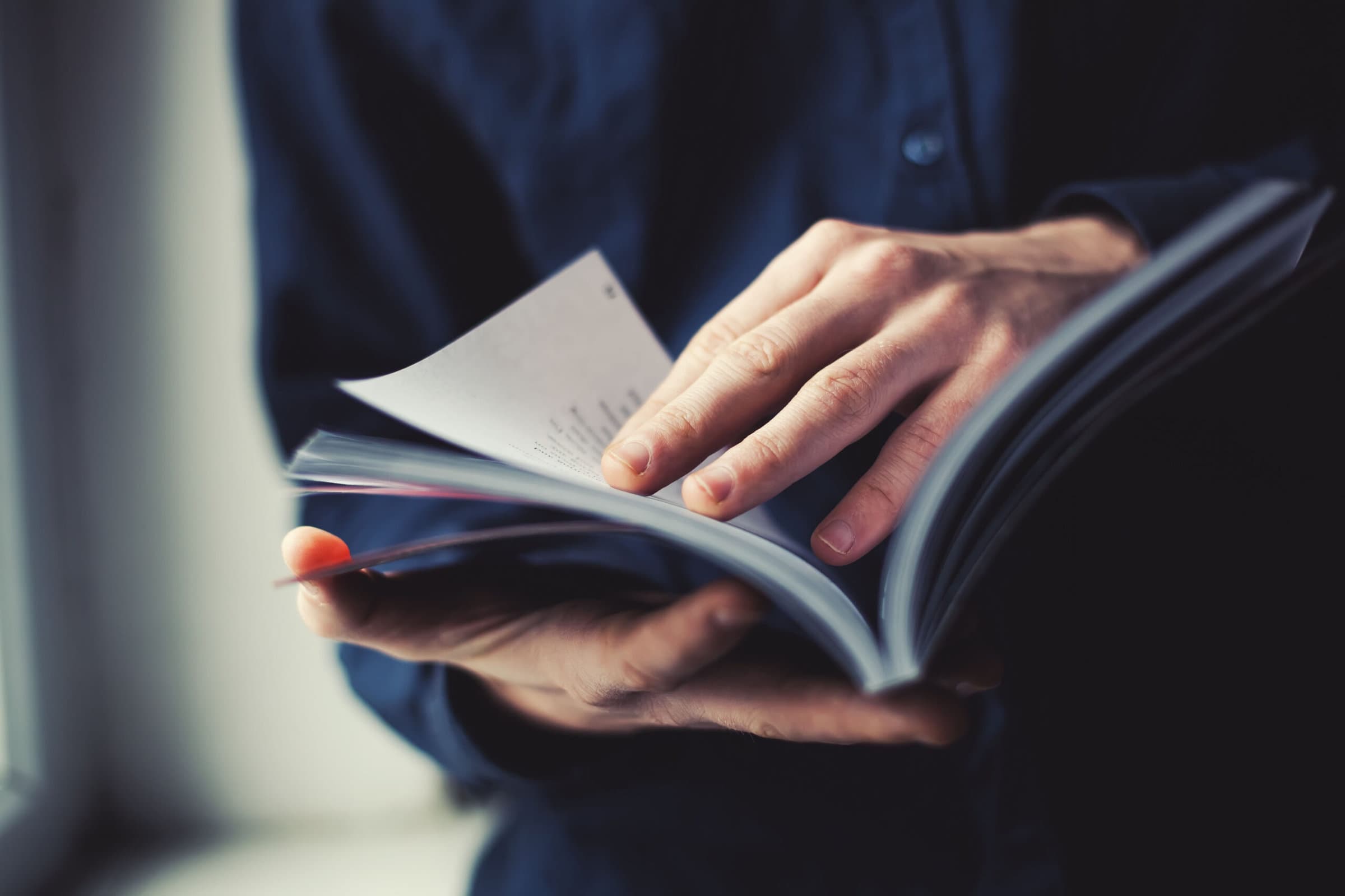 man reading a magazine