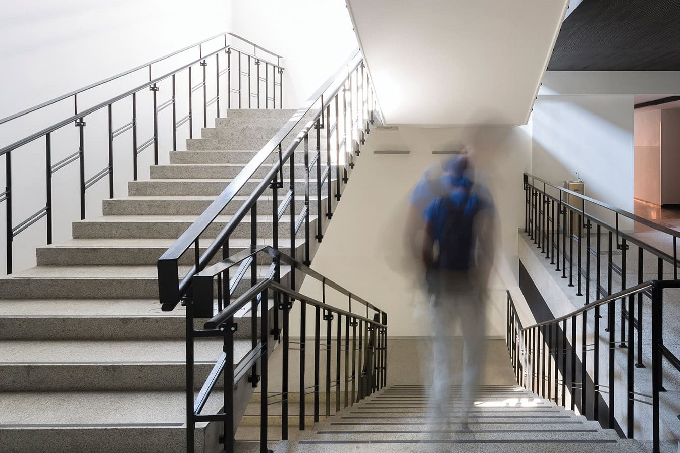 Blurred student in college or school hallway