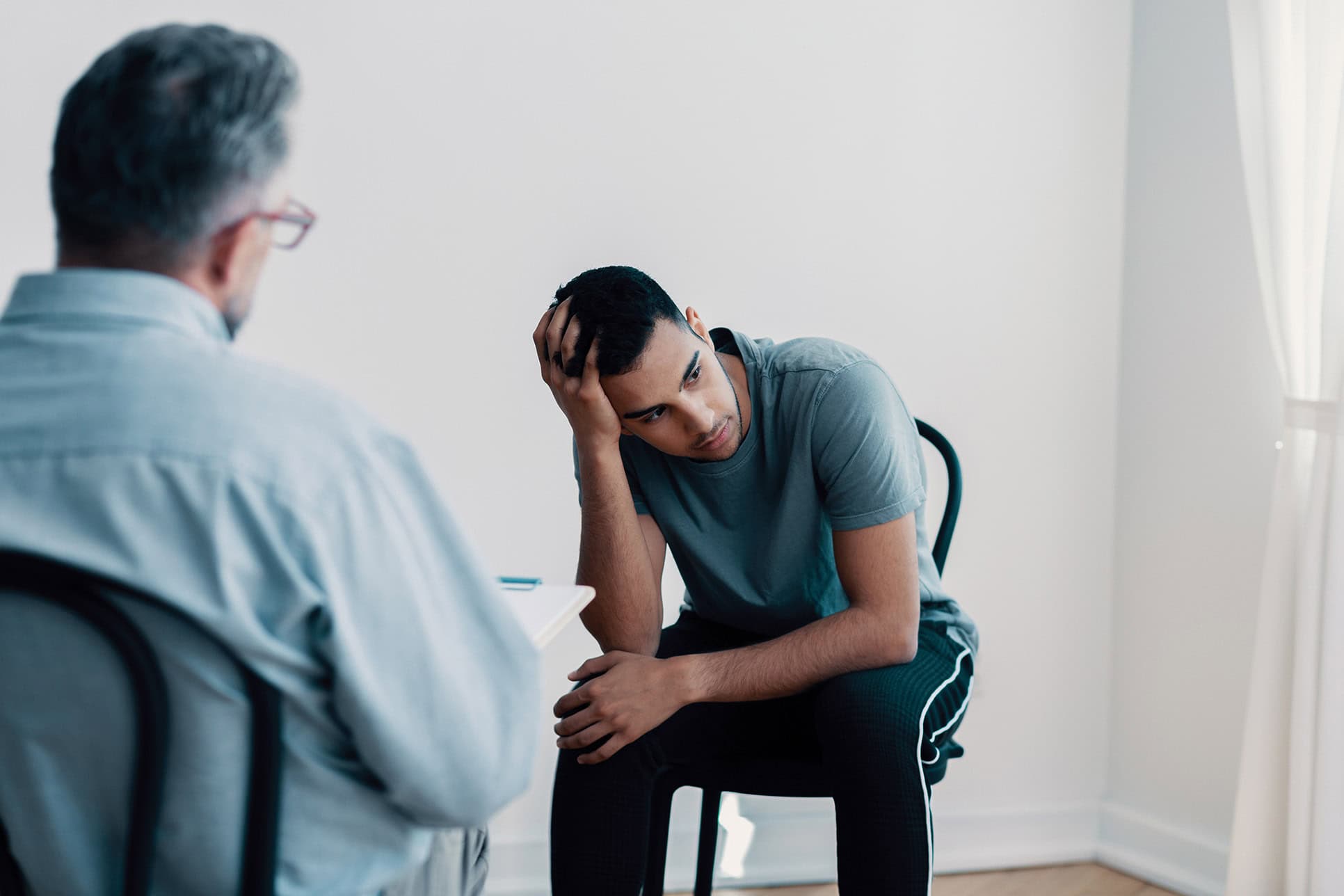 Therapeutic IEC meeting with troubled young male