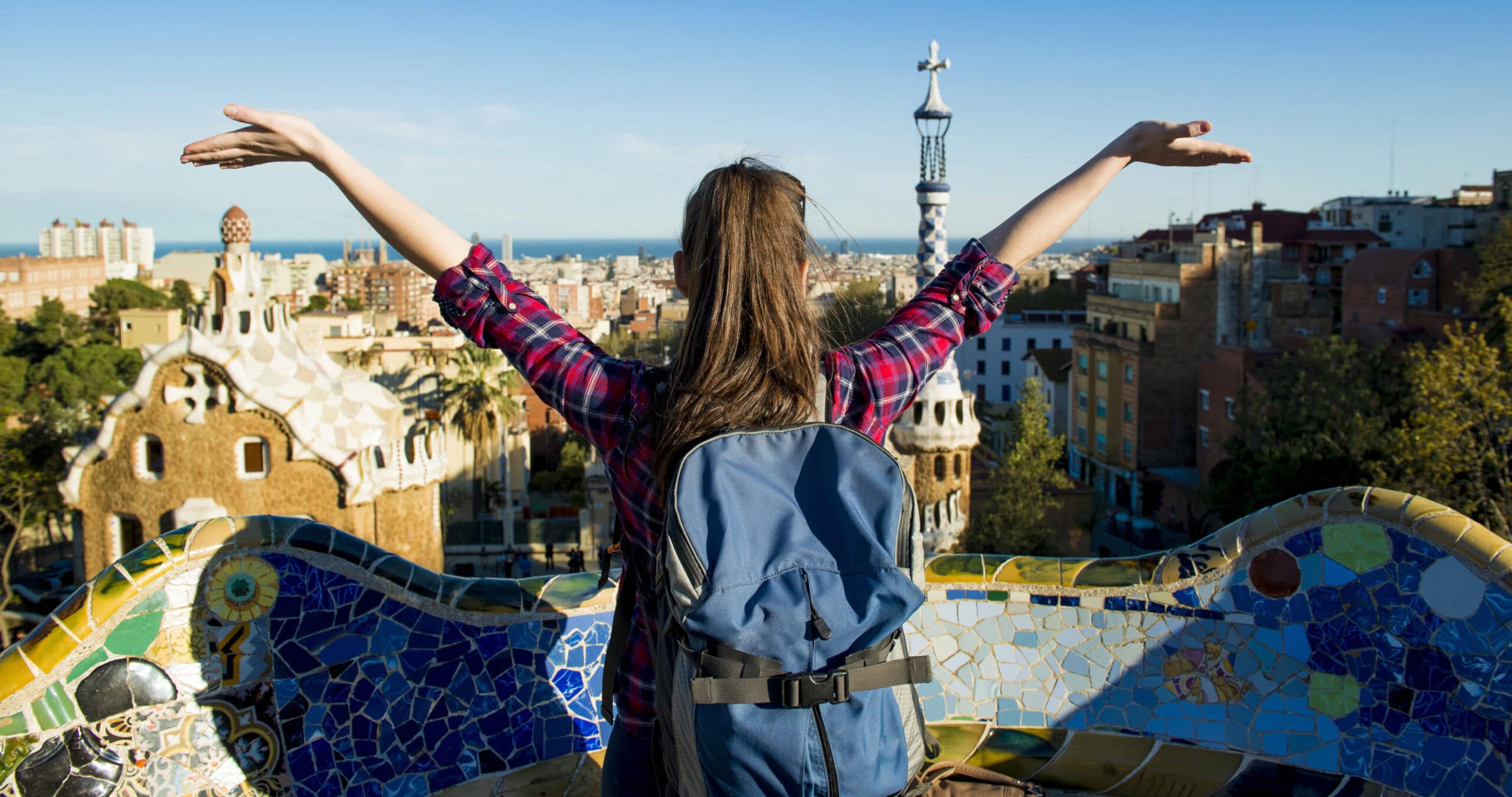 Woman with backpack in international city