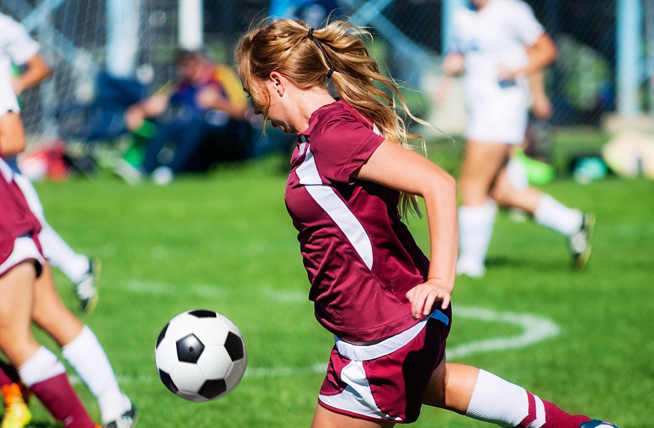 Student-athlete playing soccer