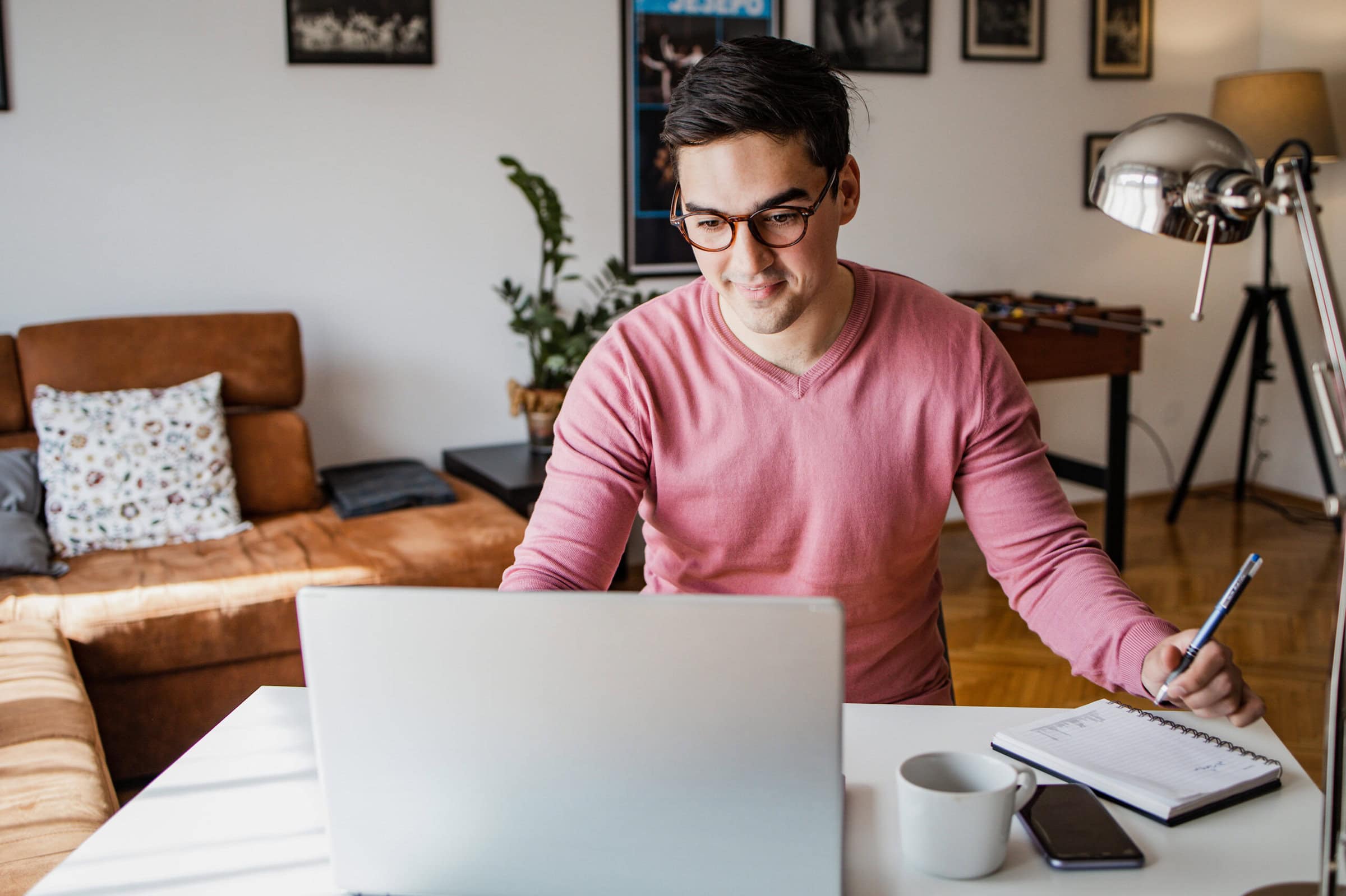 Student is shown working on computer at home