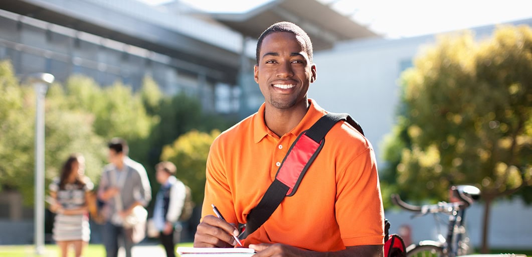 Smiling student shown outside on college campus
