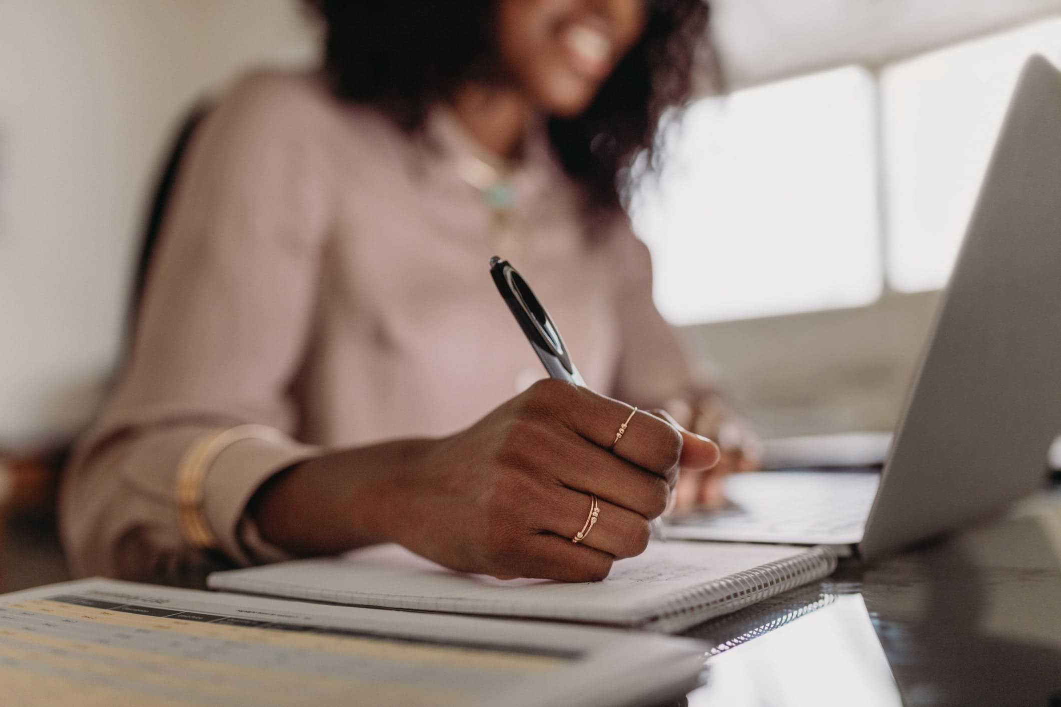Women writing in a notebook