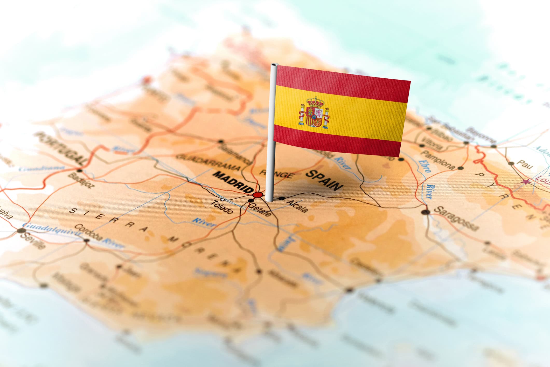 The flag of Spain pinned on the map.