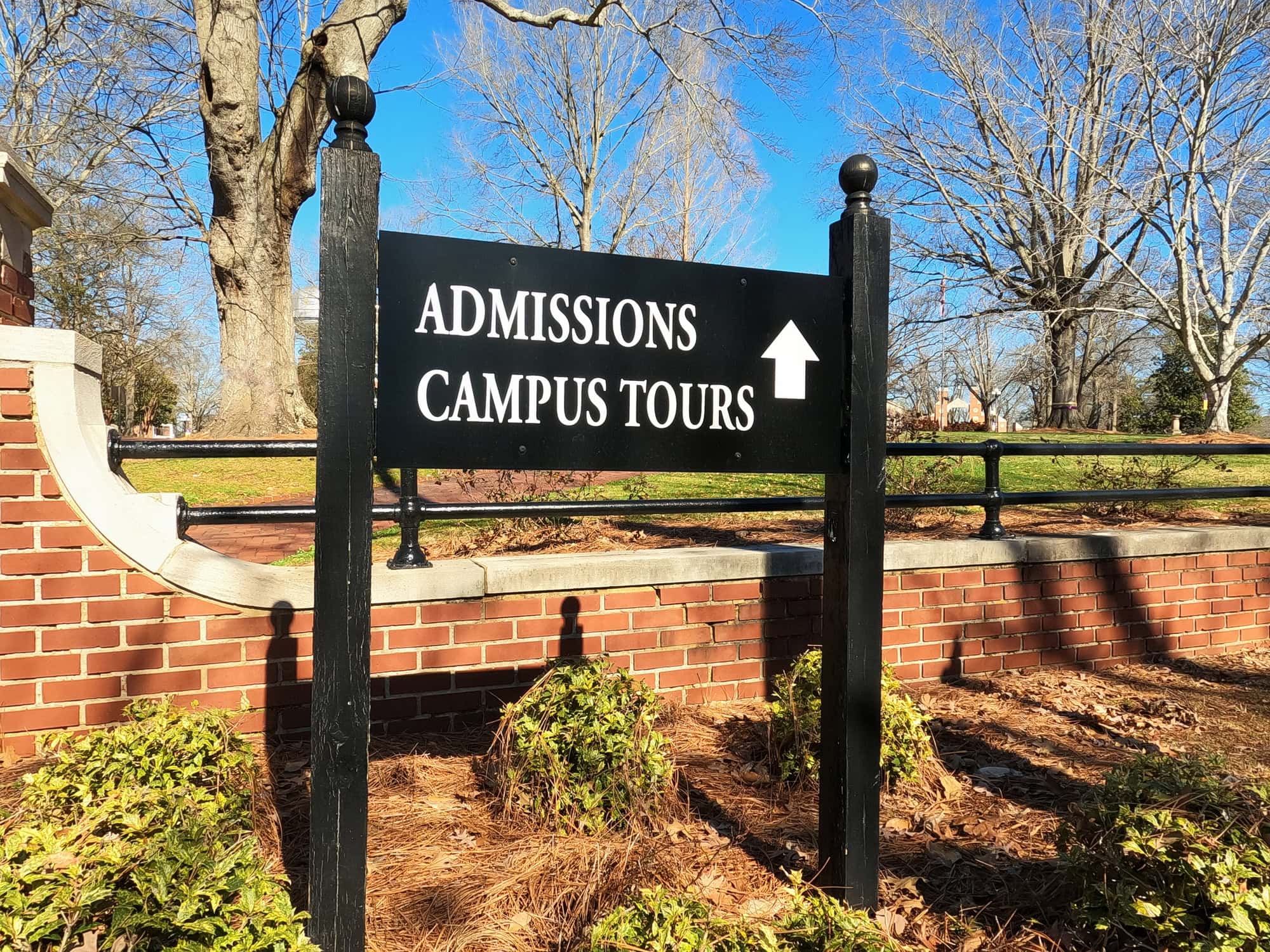 Close up of admissions campus tour directional sign on public university campus