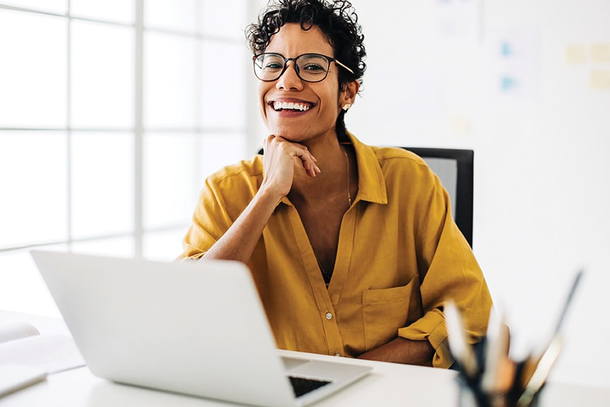 Professional business woman smiling at the camera.