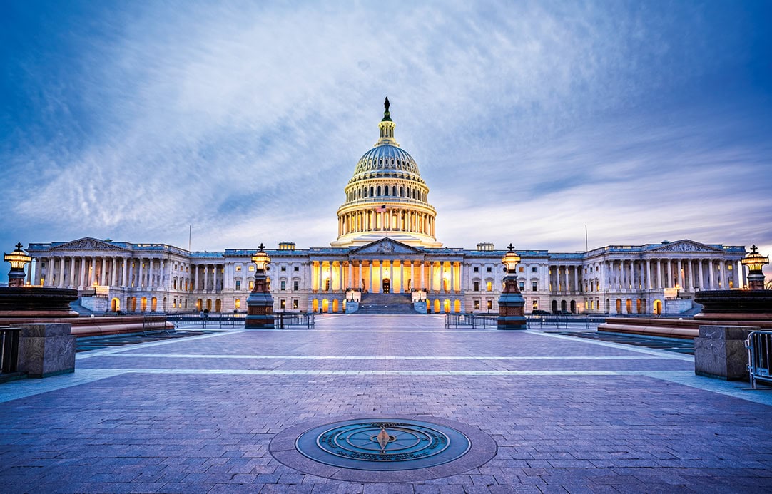 The Capitol Building in Washington, D.C., USA lit up in the early evening.