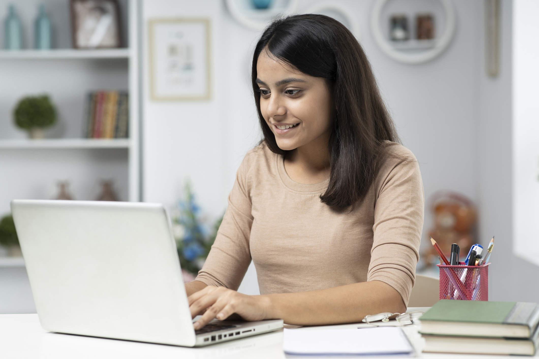 Young woman working on computer at home