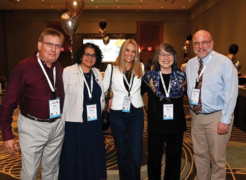 Smiling group of IECA member volunteers at the Volunteer Reception during the Detroit conference