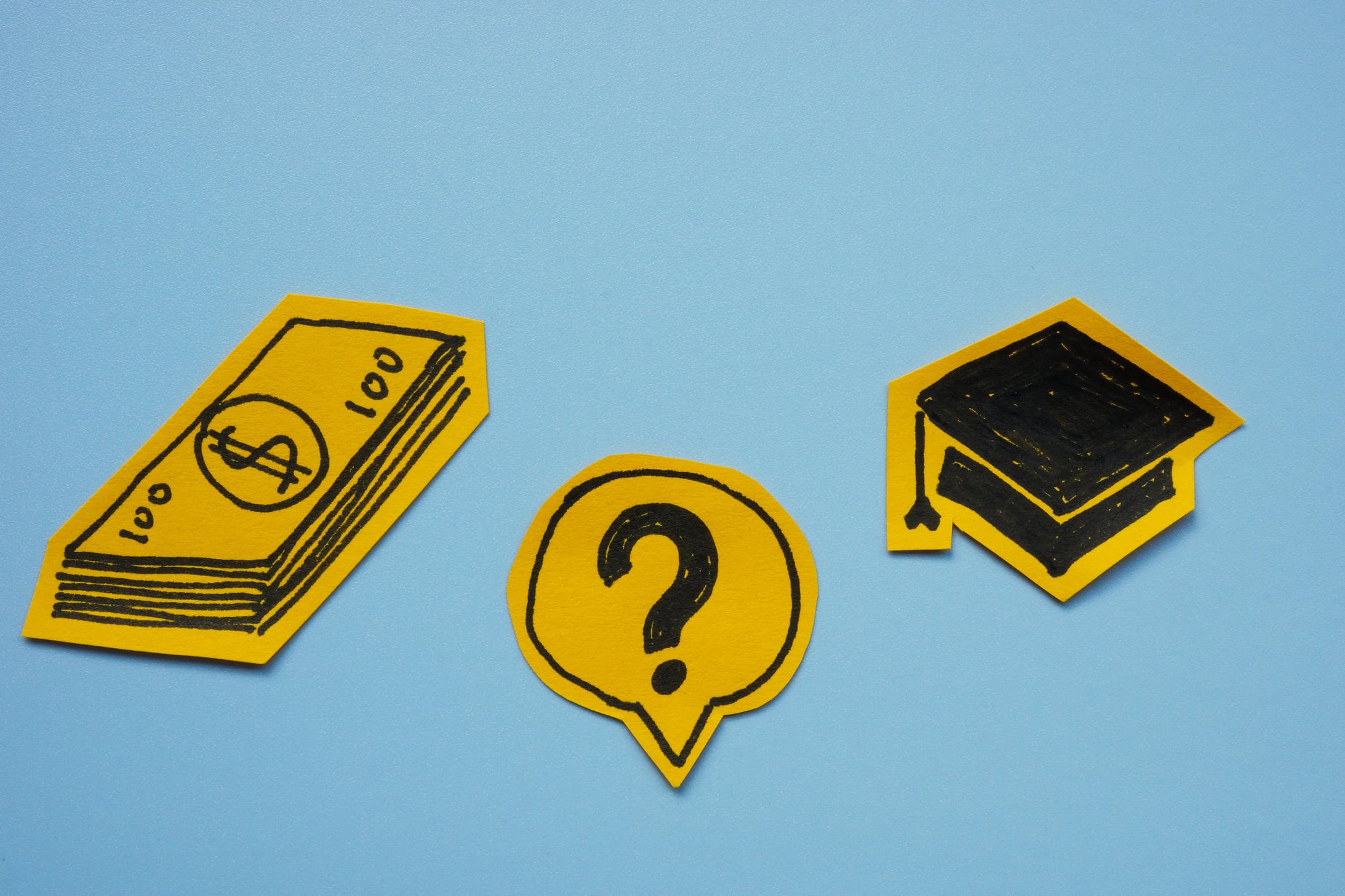 Student loan and financial decisions. Graduation cap, dollar bills, and a question mark.