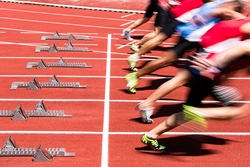 Athletes in sprint start in track and field